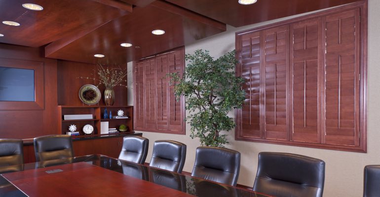 Wooden shutters covering a conference rooms’ windows